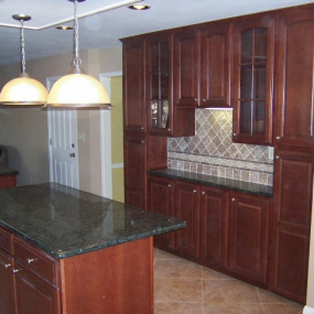 Kitchen remodeling cherry cabinets and island with bar