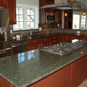 Arvada Kitchen remodeling stove in kitchen island with ventilation hood