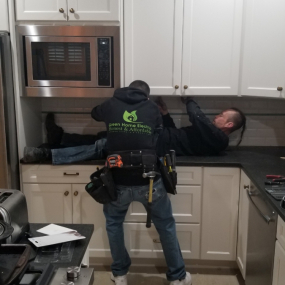 Installing cabinets in kitchen remodeling in Denver